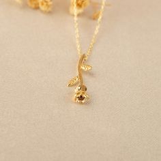 Our 14K Solid Gold Rose Necklace is a testament to timeless beauty and romantic elegance. This exquisite necklace features a rose flower pendant, elegantly crafted and sized at 4.6mm by 24.5mm. Whether you choose the classic appeal of Gold, the gentle allure of Rose Gold, or the modern touch of White Gold, each variant adds a unique charm to the necklace. The skinny cable chain, with a thickness of 0.89 mm, offers an adjustable length of 16" to 18", providing versatility and comfort for various Elegant Gold Necklaces With Rose Details, Elegant Gold Necklaces With Roses, Elegant Formal Jewelry With Birth Flower Detail, Elegant Rose Jewelry For Mother's Day, Elegant Rose Detail Necklaces For Anniversary, Elegant Rose Necklaces For Anniversary, Gold Elegant Necklace With Rose Design, Elegant Flower Pendant Necklace For Anniversary, Elegant Rose Detail Necklaces For Gifts