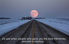 an empty road with a full moon in the background and a quote written on it