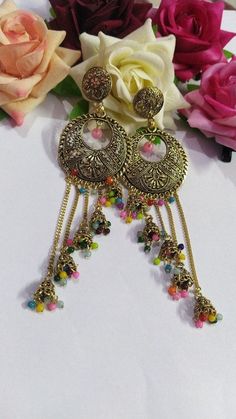 Introducing our exquisite Oxidised Love Birds Earrings with Monalisa Stones, a perfect combination of elegance and charm. These earrings are designed to capture the essence of love and beauty, showcasing intricate details and stunning craftsmanship. The oxidized finish gives these earrings a vintage and antique look, adding a touch of uniqueness to your style. The design represents the bond between two souls, symbolizing love, togetherness, and harmony. Embellished with Monalisa stones, these ea Festive Fusion Dangling Beads Earrings, Multicolor Metal Jewelry With Intricate Design, Traditional Dangling Beads Earrings For Celebration, Traditional Earrings With Dangling Beads For Celebration, Vintage Chandbali Earrings, Multicolor Metal Chandelier Earrings, Celebration Chandbalis With Dangling Beads, Traditional Dangling Beads Drop Earrings, Traditional Drop Earrings With Dangling Beads