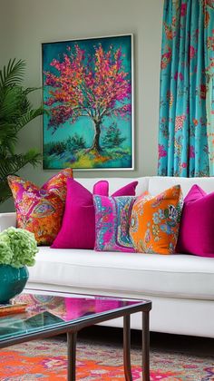 a living room filled with furniture and colorful pillows on top of a white couch next to a window