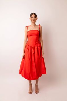 A stunning strapless midi dress with stretch fitted bodice and a full cotton skirt. Drawstring tie details either side of the bodice to create a slight ruched effect. The skirt is fully lined and has a classic puff ball effect. Fitted Orange Dress With Smocked Bodice, Orange Puff Dress, Orange Puff Sleeve Dress, Summer Orange Strapless Sleeveless Dress, Playful Orange Cotton Dress, Strapless Midi Dress, Skirt Jumpsuit, 80 Dress, Resort Collection