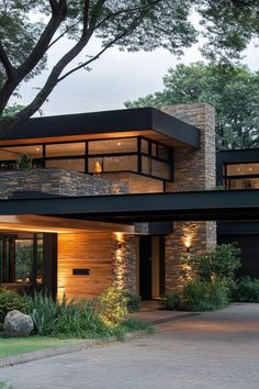 Contemporary house with stone and wood accents. Homes that are not only chic and sleek, but also clever enough to make your tech-savvy toaster feel right at home. Modern House Wood, Transitional House Exterior, Contemporary Architecture House, Dark Modern House, Modern Minimalist House, Modern Contemporary Homes, House Aesthetic, Rustic Stone