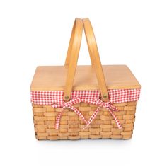 a picnic basket with a red and white checkered ribbon tied around the handle, isolated on a white background