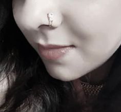 Elevate your style with our stunning High-Quality Silver and Rose Gold Clip-On Nose Ring, a perfect fusion of boho aesthetics and timeless elegance. This non-piercing nose clip offers a sophisticated alternative, allowing you to showcase your unique style without the commitment of a piercing. Meticulously crafted, the rose gold nose ring boasts a solid design adorned with a sparkling diamond, exuding an air of refined charm. 💎 Immerse yourself in the allure of our handcrafted jewelry, where eve Rose Gold Nose Ring, Diamond Nose Ring, Gold Nose Rings, Wedding Bridal Jewellery, Nose Stud, Cz Diamond, Nose Piercing, Silver Rose Gold, Sparkle Diamonds