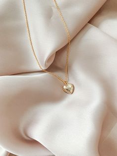 Heart Jewelry Aesthetic, Creative Jewelry Photography, Gold Locket Necklace, Jewelry Photography Styling, Jewelry Photoshoot, Mini Gold, Heart Locket Necklace, Gold Locket, Jewelry Photography