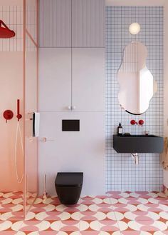 a bathroom with a toilet, sink and mirror on the wall next to each other