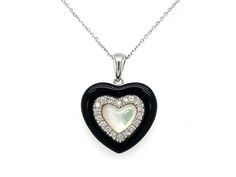 PRODUCT DESCRIPTION: 14k White Gold Dainty Heart Pendant Necklace With Diamond Outline / Black Onyx Outline / & Mother of Pearl Center / Elegant 14k Heart Gift - Solid 14k White Gold: 2.55 Grams - 18 Natural Diamonds / Total Weight: .16 Carats - High Quality Diamonds: (F-G Color / VS Clarity) - Black Onyx  - Mother of Pearl  - Pendant Dimensions: (16mm Height) x (16mm Width) - Chain Details: Solid 14k White Gold Cable Chain With Lobster Lock (Approx 1mm Chain Width)  ---------------------------- Black Open Heart Jewelry For Valentine's Day, Black Double Heart Jewelry For Anniversary, Black Necklace For Anniversary On Valentine's Day, Black Double Heart Necklace For Anniversary, Black Heart Necklace For Anniversary, Black Necklaces For Anniversary On Valentine's Day, Black Heart Pendant Jewelry For Formal Occasions, Valentine's Day Black Necklace For Anniversary, Elegant Black Double Heart Necklace