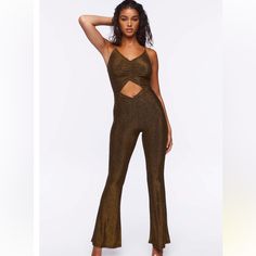 A Glitter Knit Jumpsuit Featuring A V-Neckline, Straight-Cut Back, Ruched Bust, Midsection Cutout, Adjustable Cami Straps, Concealed Back Zipper Closure, And A Flare Leg. - 75% Nylon, 21% Metallic Yarn, 4% Spandex - Model Is 5'10" And Wearing A Small New Without Tags. Brand Tag Removed To Prevent Returns To The Company. Inventory #8097 Metallic Yarn, Knit Jumpsuit, Brand Tags, Straight Cut, Cut Out, Pant Jumpsuit, Spandex, Jumpsuit, Pants For Women