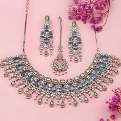 Embrace the feeling of elegance with our Fariba Necklace Set, a must-have from our Royal Heritage collection that combines luxury and grace. Carefully crafted, this stunning necklace set embodies the perfect blend of American chic and Indian artistry. The dazzling colors of the stones effortlessly blend together, adding a touch of opulence to any outfit. From its refined elegance to its cross-cultural charm, this set makes a statement of timeless beauty for every occasion. Handcrafted Metal: Met Elegant Jewelry Sets With Jewels For Celebration, Elegant Jewelry Sets For Celebration, Crystal Bridal Necklace With Jewels For Celebration, Cubic Zirconia Jewels Jewelry Sets For Celebration, Cubic Zirconia Jeweled Jewelry Sets For Celebration, Cubic Zirconia Jewelry Sets For Celebration, Elegant Bridal Necklace With Jewels For Festive Occasions, Elegant Jeweled Bridal Necklace For Festive Occasions, Luxury Cubic Zirconia Jewelry Sets For Festive Occasion