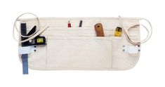 a white canvas bag with tools in it