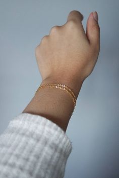 This gold filled bracelet is perfect for everyday stacking bracelet or wear it alone for a minimalist look! Choose your style from 1 or 2 stands! - Chain - 18k gold filled chain -  With 1 inch extender We do NOT accept returns or exchanges for these bracelets. Please shop carefully. If you have any questions about the length/fit, please don't hesitate to contact us! MEASURING YOUR WRIST - FIND THE PERFECT FIT! If you have a seamstress tape measure, wrap it around your wrist to a comfortable fit. If you don't have a seamstress tape measure, take a piece of yarn or string and wrap that around your wrist to a comfortable fit, marking the point where the end touches itself. Lay the string straight next to a ruler and note the length. All of our bracelets have 1-inch extender chains so most cus Dainty Everyday Chain Bracelet, Dainty Delicate Chain Bracelets For Layering, Delicate 14k Gold Filled Bracelets For Everyday, Minimalist Delicate Chain Bracelet For Layering, Delicate Hypoallergenic Everyday Chain Bracelet, Minimalist Double Chain Bracelet For Gift, Minimalist Double Chain Bracelet As Gift, Minimalist Adjustable Chain Bracelets For Layering, Dainty Bracelets For Layering