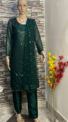 This green sequin straight kurta is made from designer sequin fabric which is eye catching in its look. This is kurta plazzo set .it is paired up with silk plazzo . Both the kurta and pants will have lining inside. We will collect your measurements as soon as the outfit is booked. Please feel free to contact us on etsy convo for further queries. Thank you Sequin Straight Kurta Salwar Kameez For Festivals, Sequin Embellished Straight Kurta Salwar Kameez For Festivals, Festive Straight Kurta Salwar Kameez With Sequins, Georgette Sequin Straight Kurta Set, Semi-stitched Sequined Anarkali Set With Straight Kurta, Bollywood Style Straight Kurta Salwar Kameez With Sequins, Bollywood Style Salwar Kameez With Sequins, Bollywood Style Straight Kurta With Sequins, Designer Green Kurta With Mirror Work