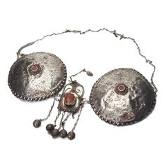 Turkmen Silver Pectoral Adornment Chain Length 24" Plate Diameter 5 1/2" Approx 90% Silver Created sometime early to Mid 20th Century with significant signs of use and wear. Fine Silver Adornments in this style are extremely rare. This would have represented a significant part of a Woman's Dowry Jewelry and has a relation to Fertility and Health. Antique Hallmarked Necklace For Festivals, Ceremonial Medallion Jewelry With Historical Design, Traditional Medallion Jewelry With Historical Design, Vintage Festival Medallion Jewelry, Antique Silver Necklace With Historical Design, Vintage Medallion Jewelry For Festival, Vintage Medallion Jewelry For Festivals, Antique Metal Jewelry For Festivals, Ornate Ceremonial Jewelry