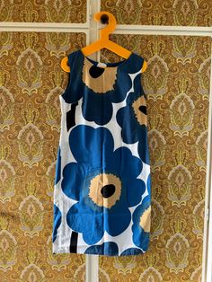 This is a wonderful sleeveless dress from Finnish company Marimekko. Probably 1990's.  Cotton with no stretch. Size 38 but runs a bit small, fits a today's size Medium best.   Good condition. Straight figure flattering model. zipper in the back. Blue and Beige Unikko Flowers, classic pattern.  Don't hesitate to ask for measurements in cm or inches. Pit - Pit: 100cm (around) ♪♫♬ Marimekko Dress, Marine Uniform, Classic Pattern, Dress Clothes For Women, Dress Blue, Finland, Blue Dresses, Sweden, Sleeveless Dress