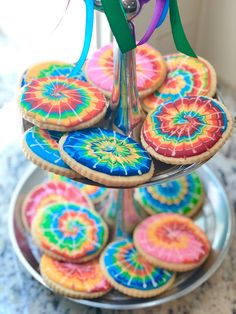 there is a plate with cookies on it that are decorated in different colors and shapes