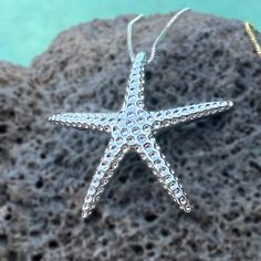 Catch a shooting star with our "Hoku" Starfish Pendant - crafted in .925 Sterling Silver or Gold Plated. Textured to mimic the look of a real starfish, it sparkles when it moves with you. Clever bale design is integrated into the pendant. This special is an 18 inch adjustable chain. "Hoku" Starfish Pendant Textured to mimic the look of a real starfish Clever bale design integrated into pendant Available in .925 Sterling Silver or Gold Plated Special matching 18 inch adjustable chain. Ocean-inspired Sterling Silver Starfish Jewelry, Starfish Shaped Jewelry With Star Charm As Gift, Silver Starfish-shaped Jewelry Gift, Silver Starfish Jewelry For Gifting, Silver Starfish Jewelry For Gifts, Silver Starfish Jewelry As Gift, Ocean-inspired Star Charm Jewelry, Sterling Silver Ocean-inspired Jewelry With Star Charm, Ocean-inspired Sterling Silver Star Charm Jewelry