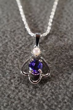 I am offering you this truly exquisite vintage unique genuine combination round and oval shaped prong set African amethyst and cultured pearl stones done in a dimensional curved scrolled design shaped , on a necklace chain. What a spectacular design.... So very elegant and a very fancy ornate setting. It is measuring a bit under 1 inch by app. 1/2 inch, you will be noticed when wearing this lavaliere necklace. The necklace chain is a very sturdy rolled rope link chain that measures a very versat Art Deco Style, Star Necklace, Necklace Chain, White Topaz, Cultured Pearls, Deco Style, Sterling Silver Pendant, Stone Necklace, Link Chain