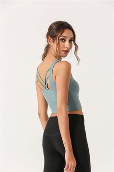 The EMES SHOP top is a perfect blend of bra and tank. for workout or personal plans. Features a soft and breathable material. a round neck front. and crossing back straps. Wear it with a high waist legging for a flawless finish. MATERIAL: 87% Nylon. 13% Spandex MEASUREMENTS: Small | Bust: 72" cm . Length: 33" cm Medium | Bust: 76" cm . Length: 34" cm Large | Bust: 80" cm . Length: 35" cm XL | Bust: 84" cm . Length: 36" cm MEASUREMENTS: Small | Bust: 28.3" in . Length: 13" in Medium | Bust: 29.9" Cross Back Sports Bra With Built-in Bra For Training, Racerback Sports Bra For Pilates, Sports Tank Crop Top With Built-in Bra, Strappy Back Sports Bra For Workout, Yoga Crop Top With Built-in Bra And Strappy Back, High Stretch Tops With Built-in Bra And Cross Back, Workout Sports Bra With Strappy Back, Cross Back Sports Bra With Straps For Yoga, Gym Tank Top With Built-in Bra And Strappy Back