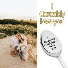 a couple sitting on top of a sandy beach next to a spoon with the words i certainly love you written on it