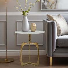 a living room scene with focus on the end table and vases in the corner