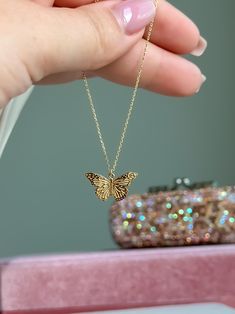 Embrace the beauty of transformation with our 14k Solid Gold Beautifully Detailed Butterfly Necklace. This elegant necklace features a meticulously crafted butterfly charm, symbolizing grace and renewal, delicately suspended from a 14k solid gold cable chain. P R O D U C T ∙ M E A S U R E M E N T S * 100% 14k Solid Gold * Necklace Length: adjustable from 16 to 17 inches * Necklace Width: 1mm * Chain Weight: 2.10 grams  Delivery:  * Ready to ship in 1 business day. * Delivers in 1 to 5 days depending on location and delivery option. * Returns are accepted within 7 days from the delivery date, at the customers cost. Gift Option: * We cherish the joy of gifting, as do you and your loved ones. Feel free to inform us if            you desire an additional personalized note with your order to ma Fine Jewelry Butterfly Charm As Gift, 14k Gold Pendant Necklace With Butterfly Charm, Fine Jewelry Butterfly Pendant Necklace As Gift, Fine Jewelry Butterfly Pendant Necklace, Gold Jewelry With Butterfly Charm For Her, Fine Jewelry Yellow Gold Butterfly Necklace Gift, Butterfly Necklace As A Gift, Round Butterfly Necklace For Gift, Round Butterfly Necklace Gift