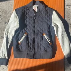 Form The Permanently Closed Who. A. U Brand, This Men’s Jacket Is Perfect For Fall Weather. With A Quilted Black Cotton Patterns In Front With Faux Leather Sleeves. Sleeves Are In Great Condition With No Cracking. Zipper Up. Some Brown At The Sleeve And Pocket Outlines. 2 Pockets In Front White Varsity Jacket For Outdoor Winter Activities, Fall Sports Cotton Outerwear, White Winter Varsity Jacket For Outdoor, Sporty Quilted Outerwear For Streetwear, Sporty Varsity Jacket For Streetwear, Varsity Track Jacket With Pockets For Winter, Winter Varsity Track Jacket With Pockets, Quilted Long Sleeve Sports Outerwear, Casual Sports Outerwear With Patchwork