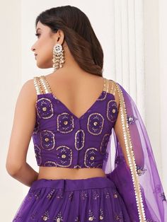 Let your elegance reflect and receive compliments with the stunning Pretty Purple Butterfly Net Lehenga Choli from Ethnic Plus. This exquisite lehenga choli in a beautiful purple color is made from high-quality butterfly net material.
Designed with a V shape neck, this party wear lehenga is sure to make you the center of attention at any occasion. The A-line silhouette flatters every body type, giving you an elegant and graceful appearance.
The lehenga comes semi-stitched and can be customized u Purple Sleeveless Wedding Set, Purple Art Silk Sharara With Dori Work, Purple Blouse Piece With Dupatta For Reception, Purple Dori Work Sharara For Eid, Designer Purple Art Silk Sharara, Purple Art Silk Sharara For Eid, Purple Choli For Eid, Purple Sharara For Navratri With Traditional Drape, Purple Art Silk Anarkali Set For Reception