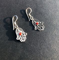 Handmade Silver Tuareg Earrings Made in Morocco Height 2cm Width 1.5cm Spiritual Adjustable Filigree Jewelry, Red Filigree Dangle Jewelry, Red Dangle Filigree Jewelry, Symbolic Metal Jewelry With Matching Earrings, Red Sterling Silver Filigree Earrings, Symbolic Pierced Dangle Jewelry, Red Bohemian Filigree Jewelry, Handmade Symbolic Round Earrings, Bohemian Red Filigree Jewelry