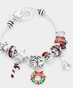 This beautiful Christmas-themed charm bracelet has an elegant look to it and is a fun detail to any outfit. Festive Holiday Jewelry With Dangle Shape, Festive Holiday Dangle Jewelry, Elegant Christmas Holiday Jewelry, Christmas Holiday Bracelet Jewelry, Adjustable Christmas Jewelry For Holiday, Christmas Holiday Jewelry Bracelet, Silver Holiday Bracelet, Silver Bracelet For Holiday, Silver Bracelets For Holiday