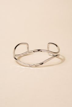 Made from high-quality metal, this bracelet features a unique open eyelid design that is sure to catch the eye. The hammered texture adds an extra dimension of interest to the piece. This cuff is adjustable to fit a variety of wrist sizes, ensuring a comfortable and secure fit. SizeLength: 6.5 in (16.51 cm)Width: 1 in (2.54 cm) Quality Made with a lightweight metal alloy to ensure that the bracelet is easy to wear and that it lasts for longer. Made with a glossy finish that make the bracelets be Hammered Metal Bracelets, Trendy Adjustable Open Cuff Bracelet, Silver Hammered Metal Cuff Bracelet, Modern Hammered Metal Cuff Bracelet, Adjustable Hammered Cuff Bracelet, Adjustable Nickel Free Trendy Cuff Bracelet, Adjustable Hammered Cuff Bangle, Trendy Adjustable Nickel-free Cuff Bracelet, Trendy Adjustable Cuff Bracelet With Oyster Design