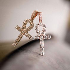 GLD's Rose Gold collection! Known as “The Key of the Nile” the Ankh Cross is one of the most sacred Egyptian symbols representing eternal life, and this bestselling piece is now available in rose gold. We carefully hand-set all stones, executing top craftsmanship. Be assured that no other Ankh will be the same as yours. This product is guaranteed for life – GLD will repair or replace the item should you experience any defects in craftsmanship or breakage. Specifications - 3/4" x 1 3/4" (Width x The Ankh, Shark Pendant, Ankh Pendant, Hand Cuff Bracelet, Ankh Necklace, Ankh Cross, Cross Earrings Studs, Egyptian Symbols, The Nile