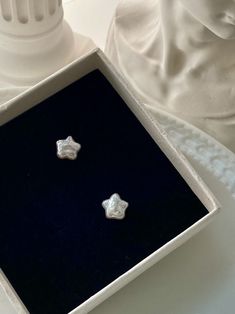 Indulge in celestial charm with these White Pearl Star Stud Earrings. Simple yet elegant, these stud earrings are perfect for everyday wear or as a subtle addition to any special occasion outfit. The unique star design and shimmering white pearls combine to create a graceful and timeless look that will capture the admiration of all who see them. Expertly crafted with high-quality materials, these earrings are a lasting symbol of your impeccable taste and refined sensibilities. Pearl Star Earrings, Cute Earrings Studs, Star Things, Pearl Earrings Studs, Star Pearl, Trendy Stud Earrings, Aesthetic Earrings, Cute Stud Earrings, Star Stud Earrings