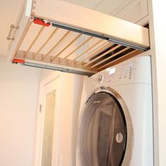 a washer and dryer in a small room