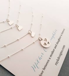 Mother and three daughters shareable necklace set. sterling silver cut out three heart disc for mother and tiny heart charm for daughters. sterling silver satellite chain. small heart charm necklace-16-18'' Cutout heart charm necklace-16-18'' *Please let me know if you need diff. length. I do not charge extra up to 20'' sterling silver cutout heart disc-13mm sterling silver tiny heart charm-7mm You can find more options for Mother daughter jewelry~ https://www.etsy.com/shop/thejewelrybar?section Mother And Three Daughters, Birthday Gift Mom, Mother Daughter Jewelry, Heart Disc, Mom Of 3, Adoption Gifts, Daughter Jewelry, Three Daughters, Daughter Necklace