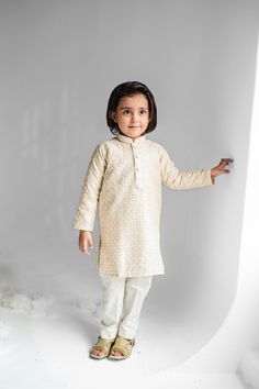 Adorable, made-to-order kurta for infant, toddler and kid boys! Available for Father and Son combo.  Kurta ➤ Luxurious cotton-silk fabric in light cream ➤ Easy open buttons - push/clasp buttons for infants! ➤ Beautifully embroidered self-design ➤ Wide neck to easily fit over baby's head Pajama / Pant / Trouser ➤ Breathable and easy-to-wash cotton fabric ➤ White to match with several kotis, kurtas, and occasions ➤ Stretchable elastic waistband Choti Koti kurtas are made without a nehru collar for Boy Kurta, Shalwar Kameez Pakistani, Pant Trouser, Cotton Silk Fabric, Eid Outfit, Boys Kurta, White Pajamas, Baby Boy Clothing Sets, Kurta Pajama