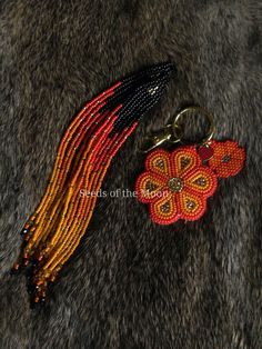 Created by an Inspired Indigenous woman. ✨️  Made in Ontario, Canada with Toho beads, Miyuki seed beads, black transparent rondelles, preciosa bicone beads, black wildfire thread, crystal wildfire thread, white Miyuki nylon thread, gold keychain hardware, red enamel heart, and black Miyuki nylon thread. Measurements Earrings: 6.5"L x .6"W Keychain: 2"L x 1.8"W Please enter your ear wire preference. Scroll photos of this listing to view options currently available. ~ Miigwetch/Niawen Black And Red Beaded Earrings, Brick Stitch Flower, Gold Keychain, Flower Keychain, Toho Beads, Orange And Gold, Flower Red, Bead Ideas, Gold Flats