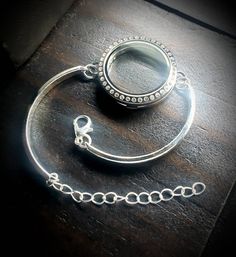 What you will receive: 1-Large (30mm) Silver Stainless Steel Floating Locket Bar Bracelet with a Crystal Magnetic Face One Size fits all (adjustable bracelet chain included) You can check out my pre-designed floating locket combinations here: https://www.etsy.com/shop/PrettyPalazzo?section_id=15744730&ref=shopsection_leftnav_4 Shipping: Orders are shipped out within 1-2 business days. Most orders can be shipped out the same day if they are ordered before 3pm Eastern Time. Great care is taken Antique Silver Stainless Steel Jewelry For Gift, Antique Silver Metal Jewelry With Lobster Clasp, Stainless Steel Round Bracelets For Jewelry Making, Nickel-free Silver Stainless Steel Jewelry, Silver Interchangeable Jewelry Gift, Silver Interchangeable Jewelry As Gift, Silver Crystal Bracelet Gift, Silver Interchangeable Jewelry For Gifts, Silver Crystal Bracelet As Gift