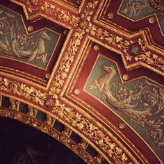 an ornately painted ceiling in a building