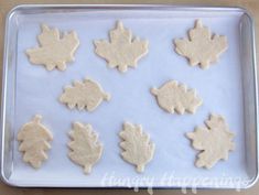 maple leaf cookies on a cookie sheet ready to be baked