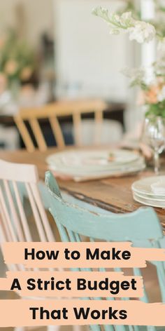 a wooden table topped with plates and glasses next to a vase filled with white flowers