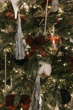 a christmas tree with ornaments and lights on it