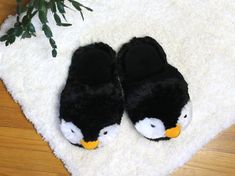 "* One Size * Footbed measures 10.5\" * Fits up to Women's size 10.5 / Men's 9 You'll be marching like the penguins in these Fuzzy Penguin Slippers, complete with fluffy black and white fur and yellow beaks. Made with cushioned foam footbeds, velvety linings, and pillowy plush uppers. Fast Shipping Times We operate M-F, and will ship out your item out as soon as we receive payment. Most orders are shipped in less than a day. Orders placed on Saturday and Sunday will ship out Monday morning. Retu Cute Slippers Fluffy, Penguin Slippers, Slippers Fluffy, Cozy Pjs, The Penguins, Animal Slippers, Fluffy Slippers, Comfy Slippers, Cute Slippers