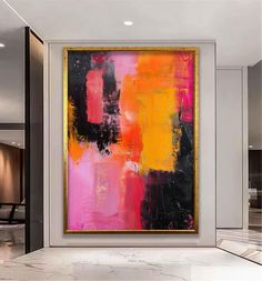 an abstract painting hangs on the wall above a marble floor