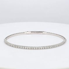 Ninacci 18K White Gold Diamond Adorned Flexible Bangle Luxury Oval Diamond Bangle, Timeless Diamond Cut Bangle Jewelry, Elegant Diamond White Gold Jubilee Bracelet, Everyday Luxury Flexible Diamond Bracelet, Elegant Adjustable Brilliant Cut Diamond Bracelet, Elegant Adjustable Diamond Bracelet With Brilliant Cut, Elegant Flexible Diamond Bangle Bracelet, White Gold Round Bangle For Everyday Luxury, Elegant Tennis Bracelet With Single Cut Diamonds