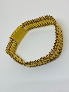 "This is a beautiful, vintage 14K yellow gold bracelet. Material(s) 14K yellow gold Measurements: This bracelet measures 7 inches in length and 14.3 millimeters in width. Weight: 24.6 grams Markings: \"14K\" If you have any questions about this bracelet, please do not hesitate to contact us! ♥" Antique Gold Bracelet Stamped 14k, Antique 14k Stamped Gold Bracelet, Vintage 14k Stamped Gold Bangle Bracelet, Vintage Yellow Gold Bracelets Stamped 14k, Vintage Gold Bracelet Hallmarked, Vintage 14k Gold Bracelets, Vintage 14k Gold Bracelets For Wedding, Vintage 14k Gold Bracelet For Weddings, Vintage Hallmarked Gold Bracelet