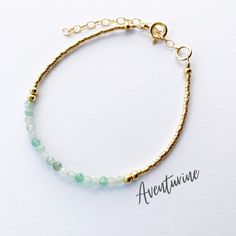 This beautiful aventurine gemstone bracelet is handcrafted with 3mm natural green aventurine beads. The gold beading is done with high quality Japanese Miyuki Duracoat delica seed beads. The larger round gold beads are 14k gold filled for lasting quality. A 14k gold filled spring clasp completes the look. It's the perfect bracelet for layering or wearing all on its own! It's simple, yet elegant design makes it a great option for every day wear. This bracelet can be purchased in either 14k gold f Gold Aventurine Beaded Jewelry, Gold Beaded Amazonite Bracelets, Adjustable Aventurine Beaded Bracelets, Gold Amazonite Beaded Bracelets, Gold Bracelets With Natural Aventurine Stones, Gold Bracelets With Aventurine Natural Stones, Elegant Aventurine Beaded Bracelets For Healing, Gold Jade Crystal Bracelet With Natural Stones, Gold Jade Beaded Bracelets For Spiritual Purposes