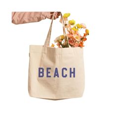 Our stylish Beach Canvas Tote is the perfect bag to pack for a seaside escape. It's a fashionable way to carry your essentials while keeping it breezy and beachy - no matter where you go! Sand-colored Travel Bags For Beach Season, Trendy Beige Beach Bag For Travel, Beachy Beige Beach Bag For Vacation, Spring Beach Bag In Sand Color, Spring Travel Canvas Beach Bag, Trendy Beige Beach Bag For Beach Season, Beige Summer Beach Bag, Sand-colored Shoulder Bag For Summer Travel, Trendy Beige Beach Bag