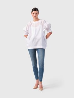 Discover the perfect blend of comfort and style with our relaxed fit blouse "Ildiko" made of 100% cotton, featuring elastic cuffs at the sleeve ends for a comfortable fit and individual adjustment, ensuring all-day comfort, suitable for any occasion, and produced in Europe under sustainable conditions for the ´Helene Galwas´ fashion label. Made of 100% Cotton. Handwash only.  Keep away from fire!  MANUFACTURER INFORMATION: Helene Galwas GmbH Schlosshof 7 82229 Seefeld Germany Phone: +49 89 416 1 Cotton Blouse With Pleated Sleeves For Daywear, Spring Blouse With Smocked Cuffs And Relaxed Fit, Cotton Blouse With Rolled Sleeves For Daywear, Cotton Daywear Blouse With Rolled Sleeves, Spring Top With Gathered Sleeves For Daywear, Effortless Cotton Blouse For Fall, Relaxed Fit Cotton Blouse For Daywear, Relaxed Fit Tops With Blouson Sleeves For Work, Spring Cotton Tops With Pleated Sleeves