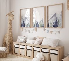 a living room filled with furniture and pictures on the wall next to a stuffed giraffe