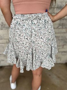 Light and airy, this Elegant Floral Printed Skirt brings a touch of whimsy to any outfit. With a tutu pleated design and mid-length cut, it's both classy and feminine. The lightweight and breathable fabric make it perfect for a summer outfit, while the shorts underneath provide added comfort and coverage. Embrace your innocence with this sweet skirt. 100% Polyester Feminine Floral Mini Skirt, Feminine Floral Print Flared Mini Skirt, Flirty Spring Mini Skirt With Built-in Shorts, Feminine Floral Print Mini Skirt, Floral Printed Skirt, Skirt With Shorts, Floral Print Non-stretch Mini Skirt, Outfit Comfortable, Cream Skirt